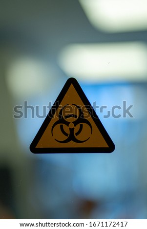 Biohazard symbol sign of biological threat alert in a coronavirus research laboratory