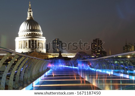 Saint Pauls Cathedral across millenium bridge at night