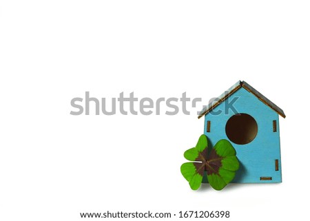 Shamrock and bird house isolated on white background