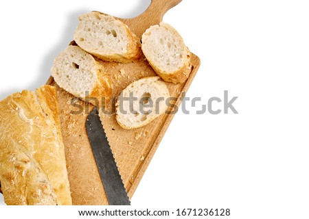 French lunch, breakfast baguette, Fresh natural French baguette, natural wooden cutting board, morning pastries from the bakery, delicate baguette, golden crust