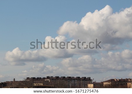clouds in the field above the houses