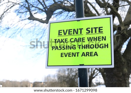 Public area where event taking place with sign of warning for safety of the public