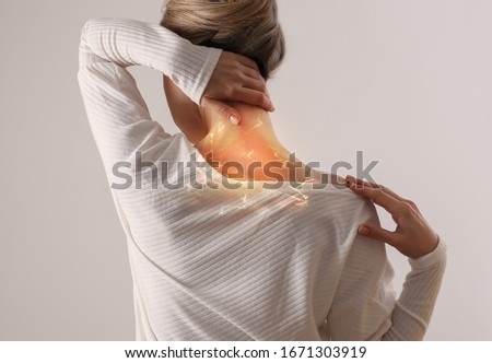 Woman suffering from back and neck pain. Chiropractic, Physiotherapy concept Royalty-Free Stock Photo #1671303919