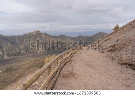 Image of path to the crater of Vesuvius in the clouds in cloudy weather, Italy