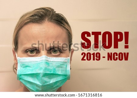 Face of caucasian woman in a mask. Woman in medical protective facial mask against virus, coronavirus and infection diseases. Banner with the text Stop! 2019-NCOV.