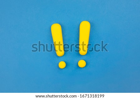 Two yellow vivid exclamation marks on blue background. Flat lay, warning sign, keep attention, alert concept. Royalty-Free Stock Photo #1671318199