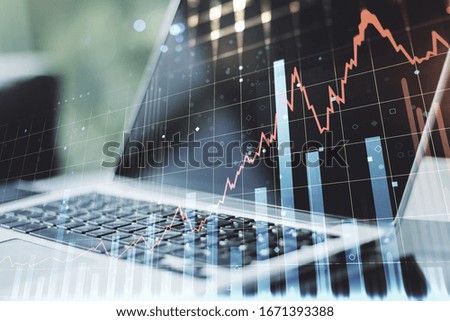Double exposure of abstract creative financial diagram on modern laptop background, banking and accounting concept