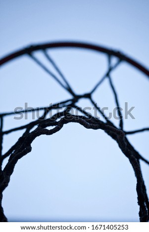 Basketball basket net at blue sky view looking across the round hoop backyard playground background