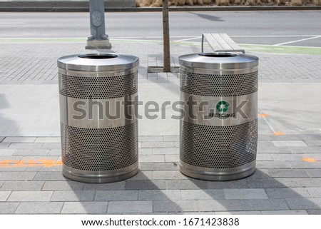 metal recycling can city sidewalk