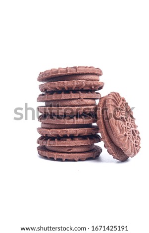 A picture of homemad chocolate cream biscuits on isolated white background.