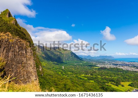 Incredible view from Nu‘uanu Pali Lookout in Honolulu on the island of Oahu, Hawaii, USA. Historical landmark and scenic spot with panoramic views. Royalty-Free Stock Photo #1671436135