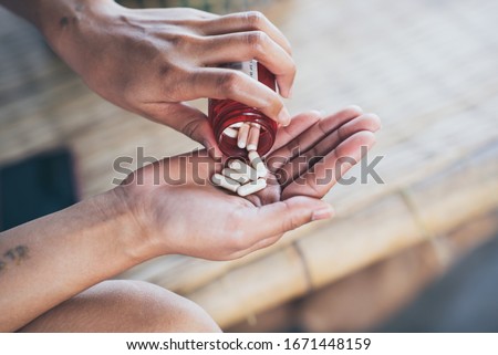 Pills and medicine in woman hands, Hazardous drugs have adverse effects on health. Royalty-Free Stock Photo #1671448159