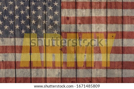 vintage american flag and army logo painted on the side of a weathered wood barn