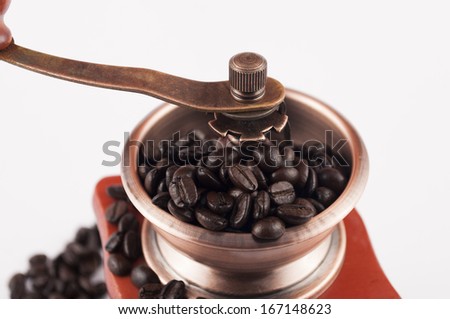 Coffee grinder and beans on top