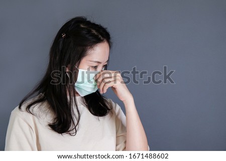 Girl with mask to protect her from virus or pollution