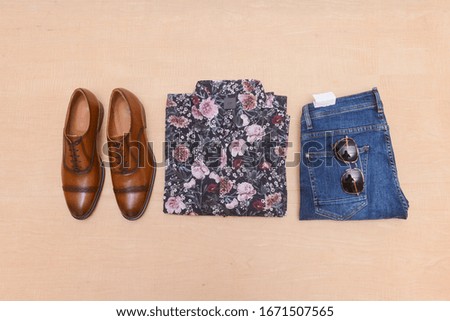 flat lay, spring fashion clothes with accessories on wooden background,
