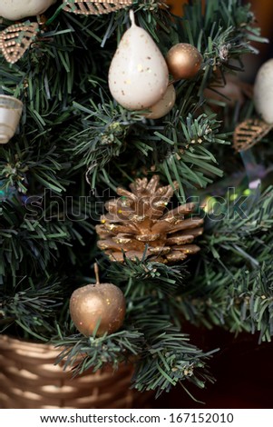 New Year's toys on a green fir-tree
