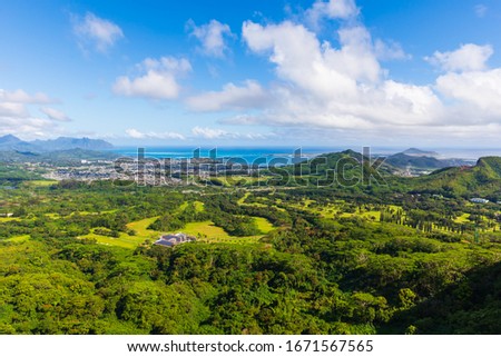 Incredible view from Nu‘uanu Pali Lookout in Honolulu on the island of Oahu, Hawaii, USA. Historical landmark and scenic spot with panoramic views. Royalty-Free Stock Photo #1671567565