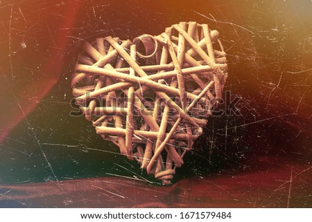 white wooden heart on a colored background