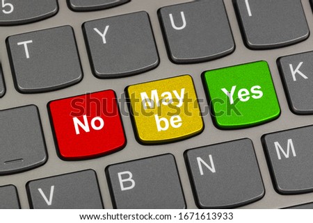 Computer keyboard with Yes No and Maybe keys - business concept
