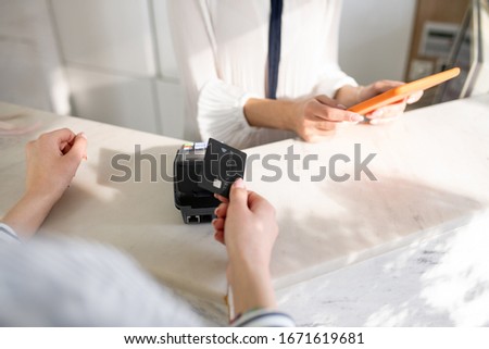 Credit card. Close up picture of womans hands holfing a credit card