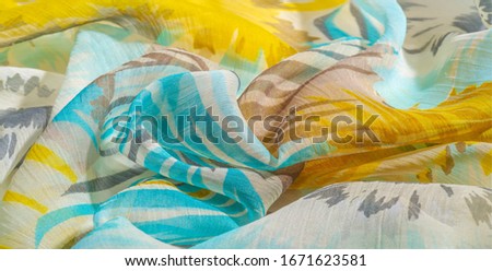 texture background pattern. Silk fabric with colored lace. Yellow blue and gray-blue shades. It is perfect for your design, accents, wallpapers, posters and postcards. Your possibilities are endless
