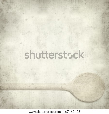 textured old paper background with wooden spoon 