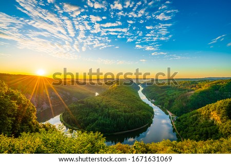 Saar river valley near Mettlach at sunrise. South Germany  Royalty-Free Stock Photo #1671631069