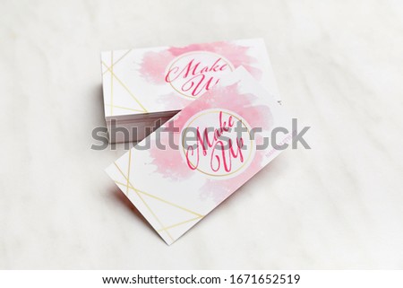Business cards of makeup artist on white background
