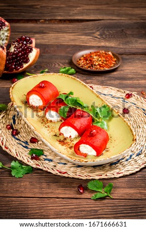 Georgian dish pepper rolls decorated with parsley
