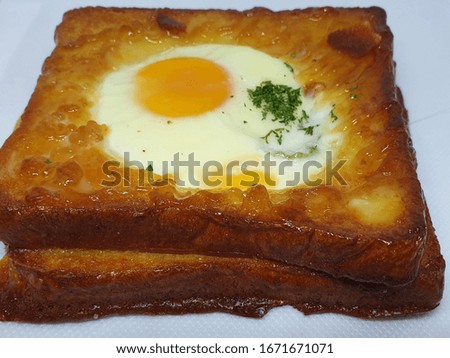 Picture of soft toast, fried egg, very appetizing