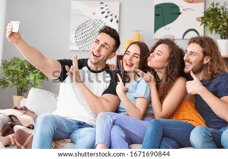 Friends taking selfie at home