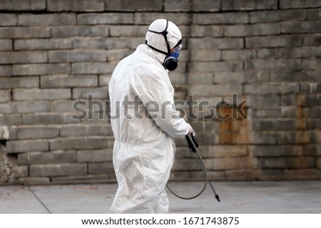 Coronavirus Quarantine. Disinfection and decontamination on a public place as a prevention against Coronavirus disease 2019, COVID-19. State of emergency over coronavirus Royalty-Free Stock Photo #1671743875