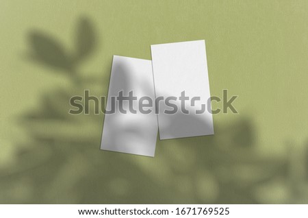 Business card Mockup. Natural overlay lighting shadows the leaves. Business cards 3.5x2 inch. Scene of Leaf Shadows.