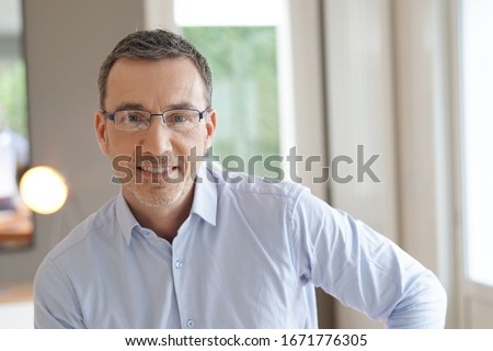Portrait of middle-aged man with eyeglasses