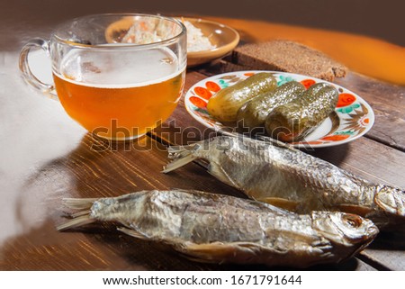 Beer and dried fish VOBLA TYPE AND Salted Cucumbers and piece  black bread