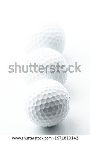 White golf balls on the white background