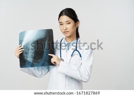 Female doctor white coat x-ray diagnosis patient