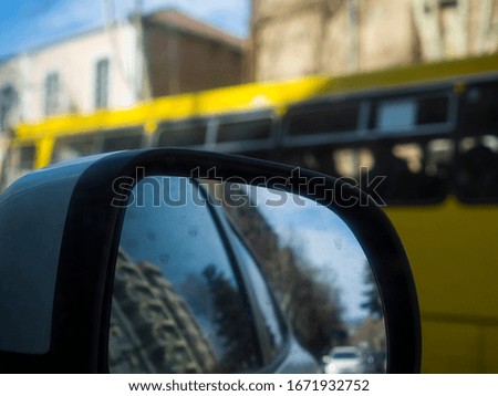 Reflection in the side mirror of the car
