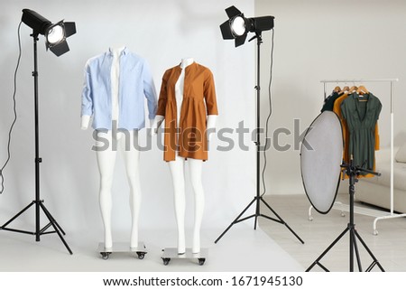 Ghost mannequins with modern clothes in professional photo studio Royalty-Free Stock Photo #1671945130