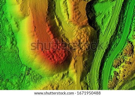 Digital elevation model  of a mine. GIS product made after proccesing aerial pictures taken from a drone by lidar laser scan. It shows map of an excavation site with steep rock walls Royalty-Free Stock Photo #1671950488