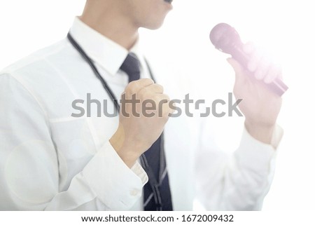 Midsection Of Businessman Giving Speech At Office