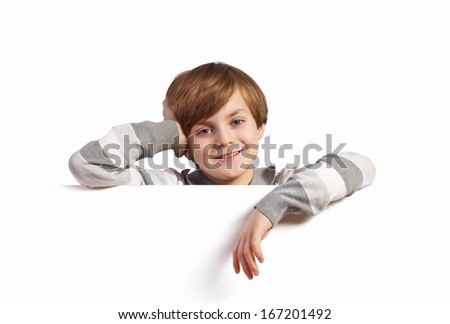 Little boy holding a blank white billboard