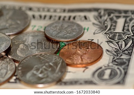 selective focus close up of us banknotes and coins