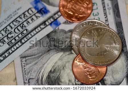 selective focus close up of us banknotes and coins