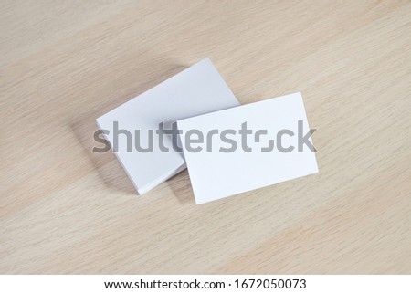 Horizontal white business card mockup on natural wood background