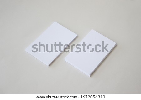 Vertical white business card mockup on light grey color background