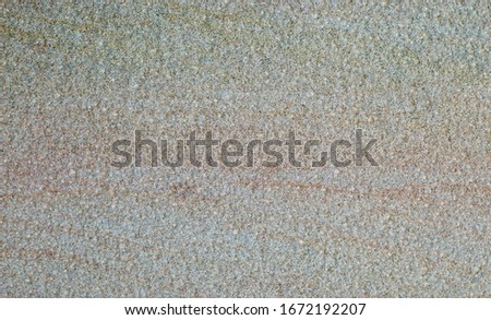 A polished sandstone surface with reddish lines, for background and graphic rescues or building materials catalogue