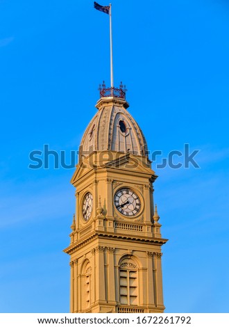 The North Melbourne Town Hall Clock Tower on Errol Street in the golden afternoon sun. North Melbourne, Victoria Australia
