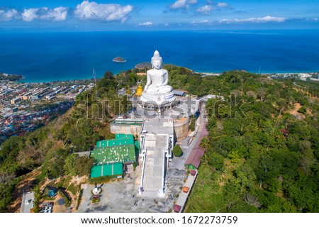 Drone Aerial view.Big Buddha of Phuket Thailand.Blue sky and blue ocean are on the back of Big Buddha white statue.Big Buddha Phuket is the one of landmarks on Phuket Thailand.(up to date)